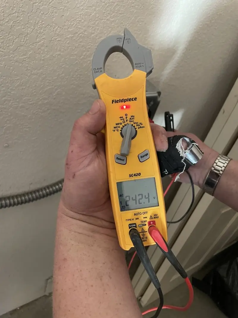 Voltage testing with clamp meter during Generator Installation in Holmes Beach